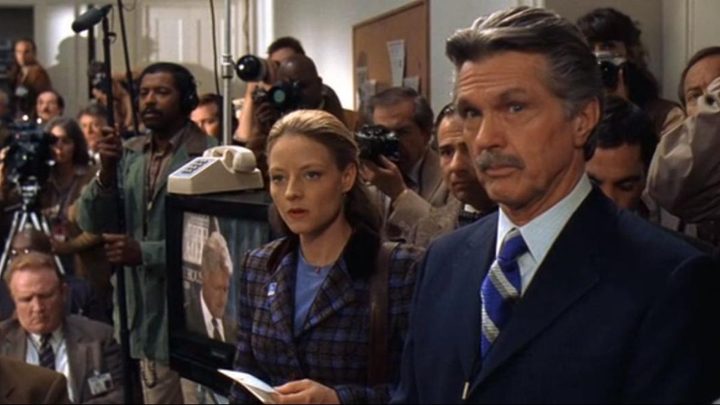 David and Ellie at a press conference in Contact.