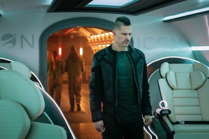 Joe Manganiello stands in a spaceship in Moonhaven.