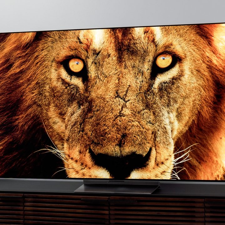 LG G2 OLED TV with a lion's face on the display.