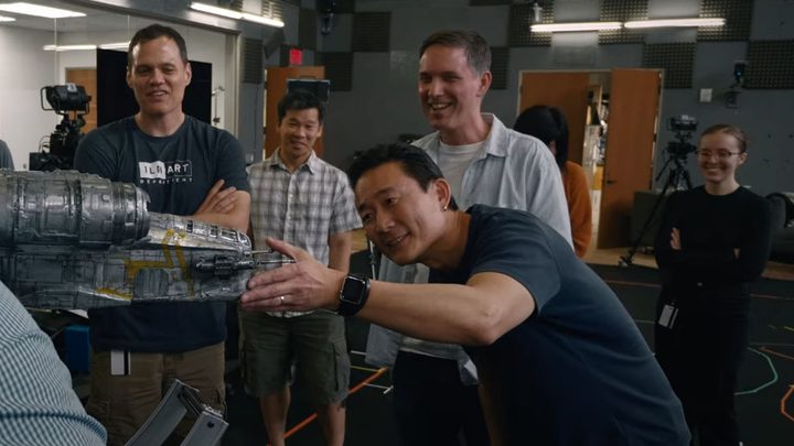 ILM artists examine a model in a scene from Light and Magic.