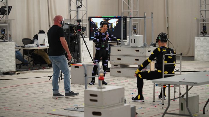 Lin Shaye and Ted Raimi act out a scene while wearing performance-capture suits on the set of The Quarry game.