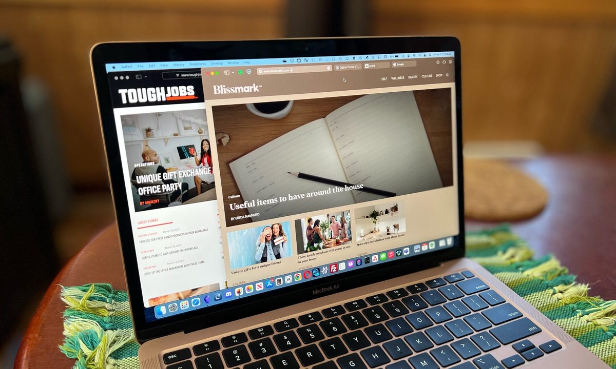 MacBook Air with Safari open and showing colored Compact Tabs.
