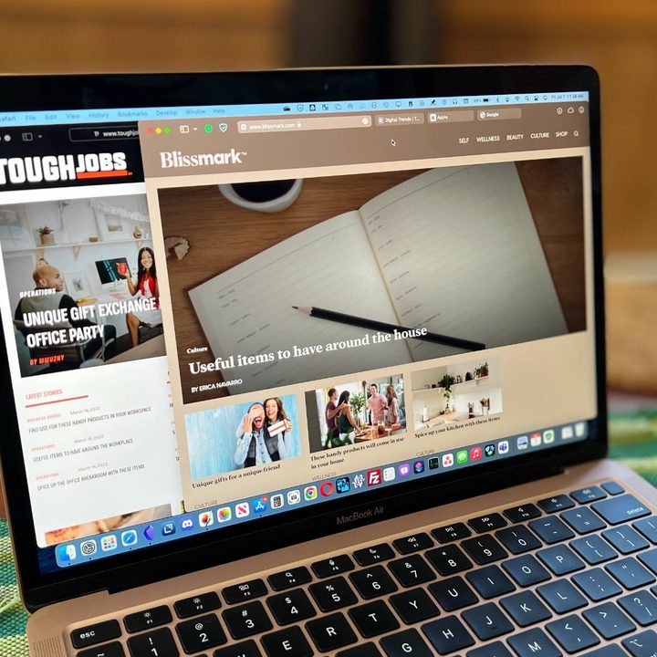 MacBook Air with Safari open and showing colored Compact Tabs.
