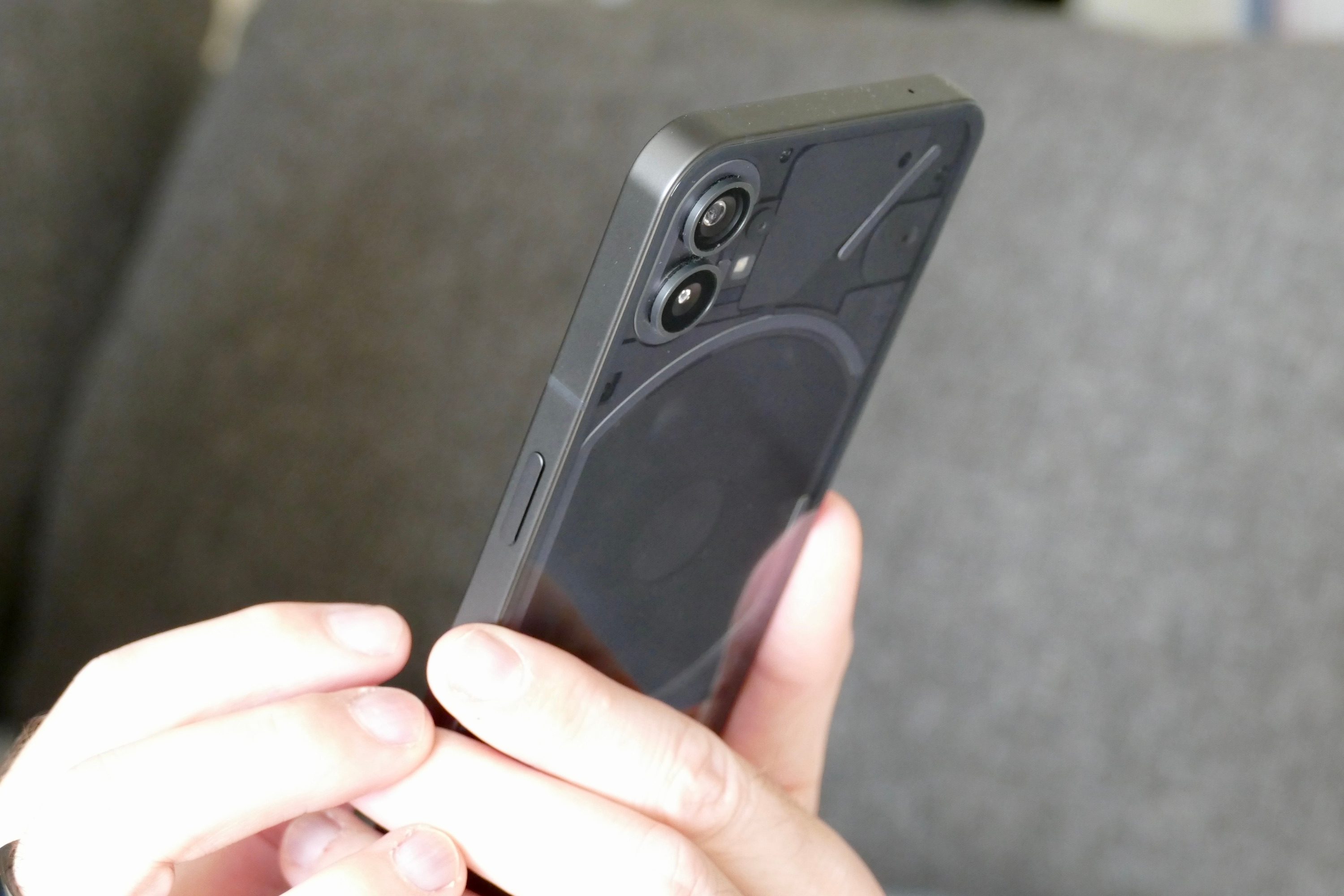 Nothing Phone 1 held in hand.