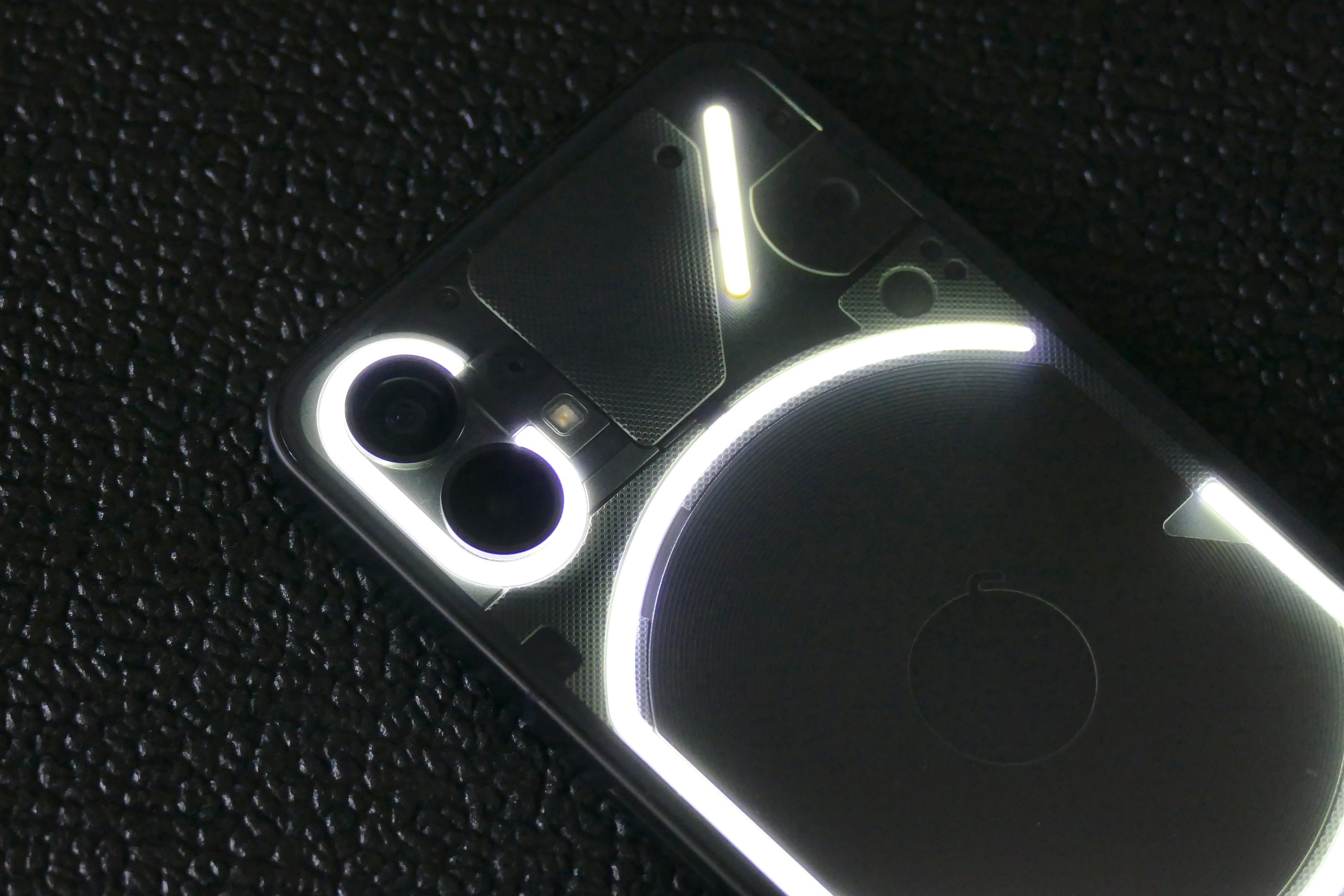 The Glyph Interface showing around the Nothing Phone 1's camera module.