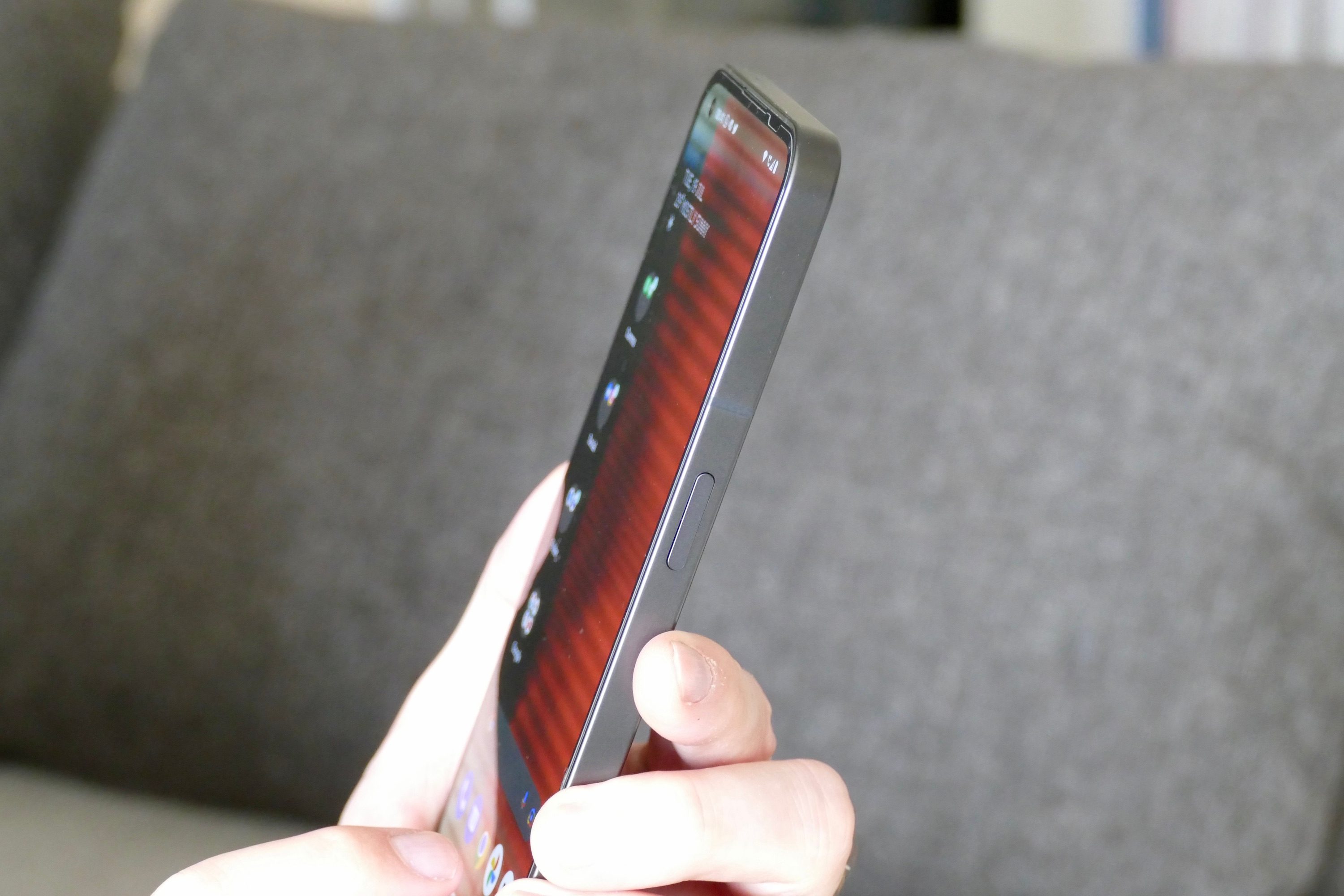 Nothing Phone 1 held in hand showing the screen.