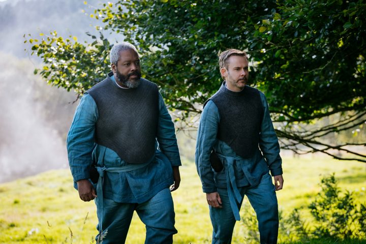 Arlo and Paul stand side by side in Moonhaven.
