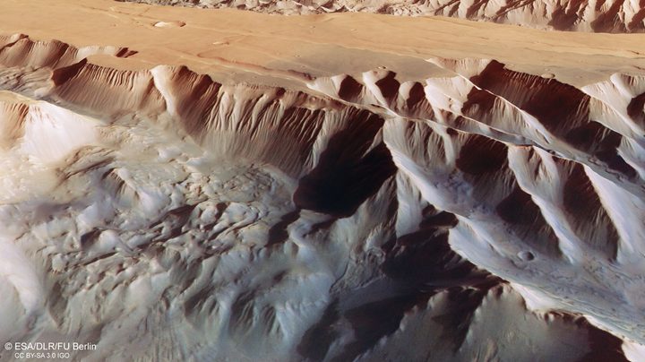 This oblique perspective view of Tithonium Chasmata, which forms part of Mars’ Valles Marineris canyon structure, was generated from the digital terrain model and the nadir and colour channels of the High Resolution Stereo Camera on ESA’s Mars Express.