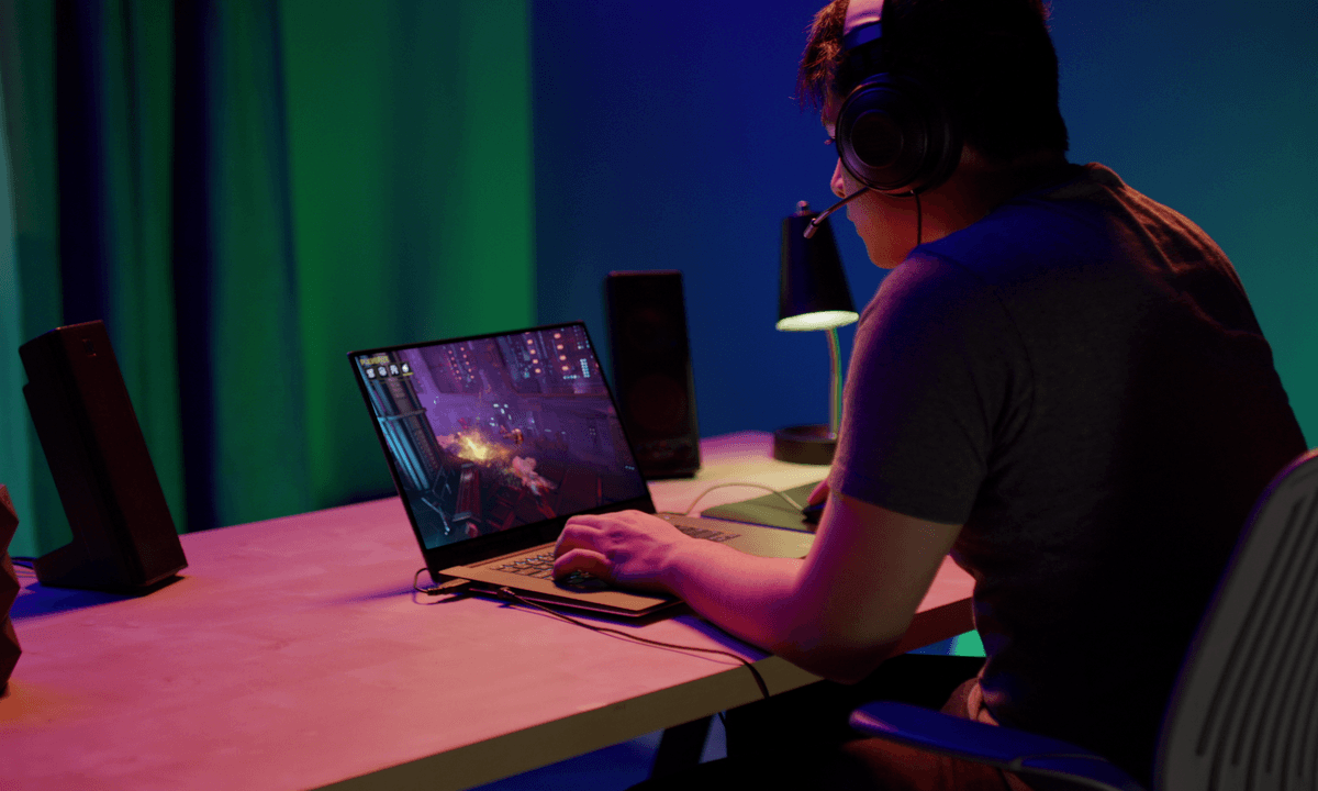 Playing games with GeForce Now on a laptop.