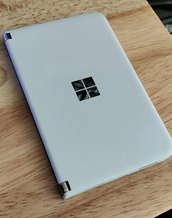 Microsoft Surafce Duo on wodden table