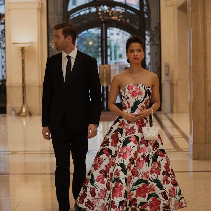 Sophie and James stand next to each other in evening wear in a scene from Surface.