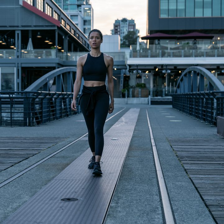 Sophie walking on the pier in a scene from Surface.
