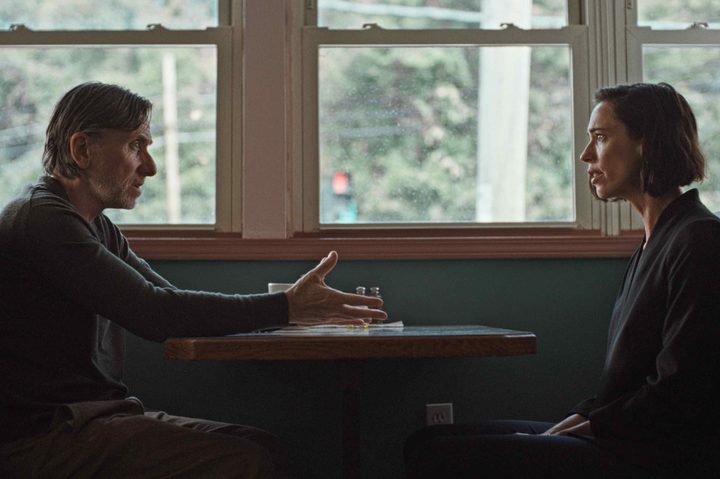 Tim Roth and Rebecca Hall sit across from each other in a diner in Resurrection.