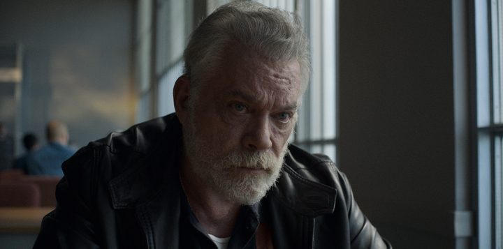 Ray Liotta sits at a table in a diner in a scene from Black Bird.