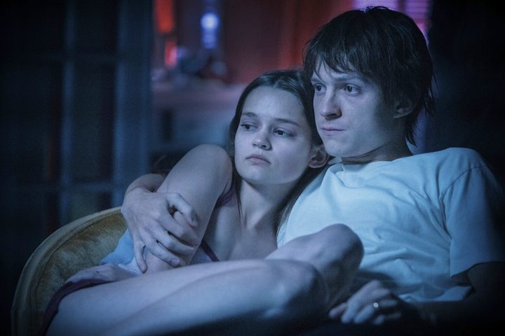 A man and a woman sit next to each other in Cherry.
