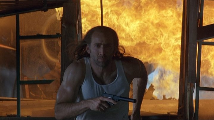 Nicolas Cage as Cameron Poe running away from an explosion in Con Air.