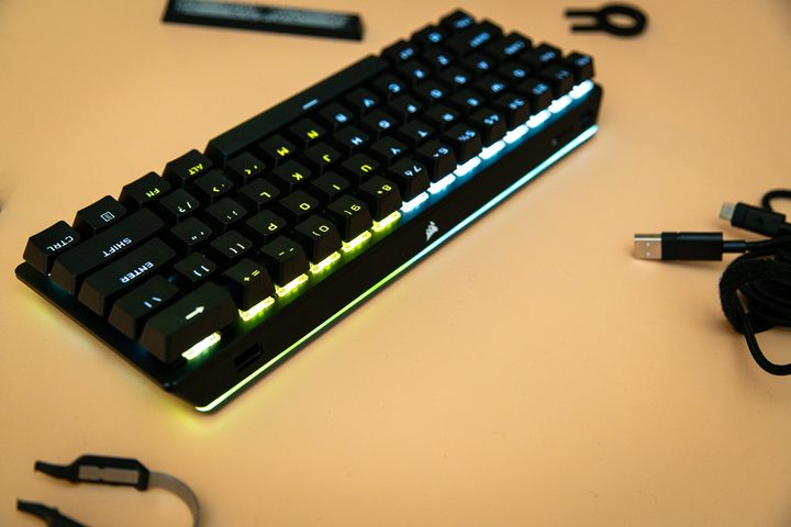Corsair K70 Pro Mini sitting among accessories.