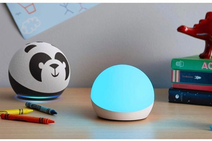Echo Dot kids (Panda) with Echo Glow on kid's desk.