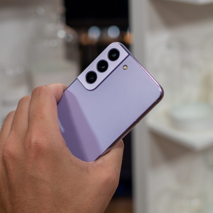 Samsung Galaxy S22 held in hand.