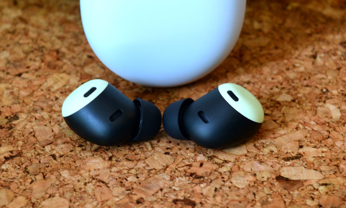 Google Pixel Buds Pro seen in front of their charging case.