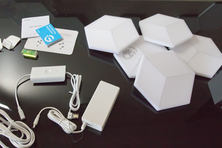 The contents of the Govee Glide Hexa Pro light panels box emptied onto a black table.