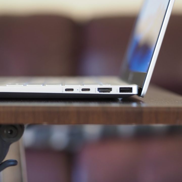 HP Pavilion Plus 14 side view showing ports and lid.