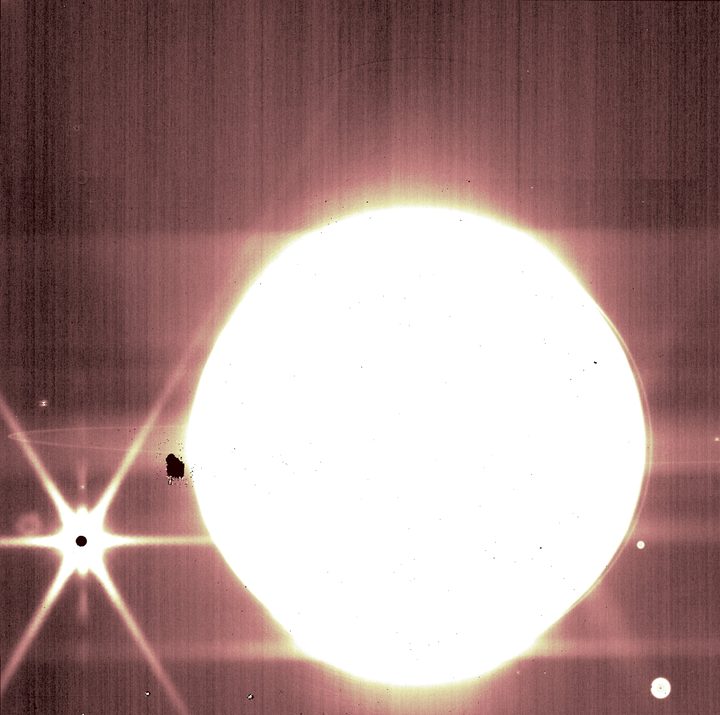Jupiter and some of its moons are seen through NIRCam’s 3.23 micron filter.