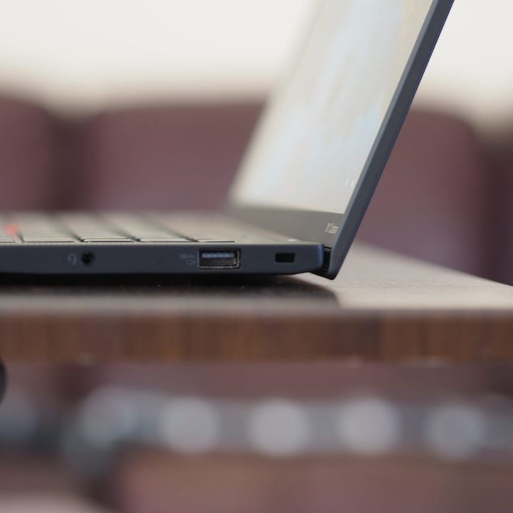 Lenovo ThinkPad X1 Carbon Gen 10 side view showing lid and ports.