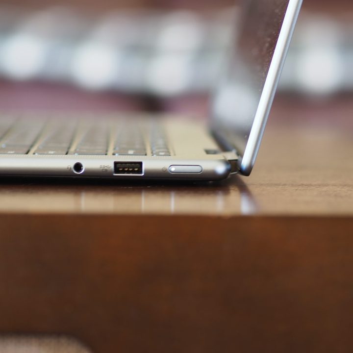 Lenovo Yoga 7i Gen 7 side view showing lid and ports.