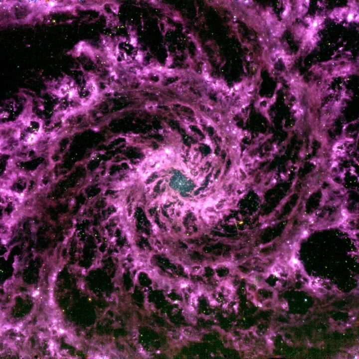 A composite of 3 monochromatic images from the MIRI instrument at wavelengths 7.7, 10, and 11 µm. The striking purple filamentary structures are emission from interstellar dust and polycyclic aromatic hydrocarbon (PAH) molecules.