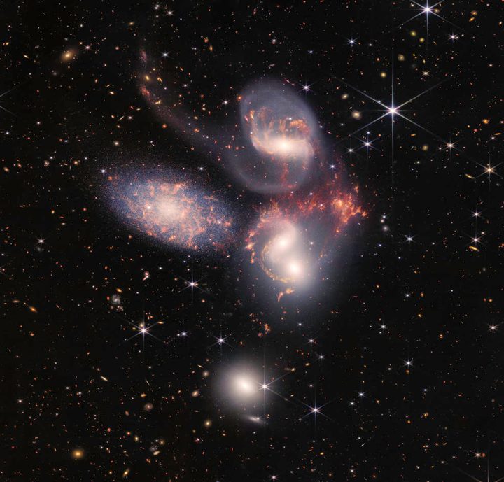 Stephan’s Quintet, a visual grouping of five galaxies, is best known for being prominently featured in the holiday classic film, “It’s a Wonderful Life.” Today, NASA’s James Webb Space Telescope reveals Stephan’s Quintet in a new light. This enormous mosaic is Webb’s largest image to date, covering about one-fifth of the Moon’s diameter. It contains over 150 million pixels and is constructed from almost 1,000 separate image files. The information from Webb provides new insights into how galactic interactions may have driven galaxy evolution in the early universe.