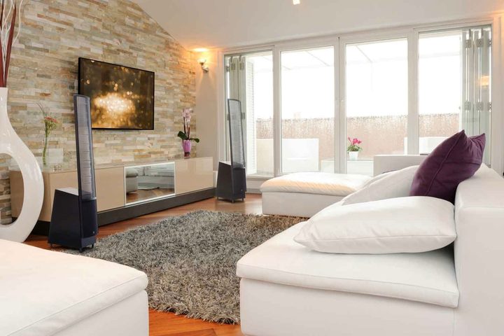 A set of MartinLogan ElectroMotion speakers set up in a living room.