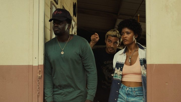 Daniel Kaluuya, Brandon Perea, and Keke Palmer stand in a doorway in a scene from Nope.