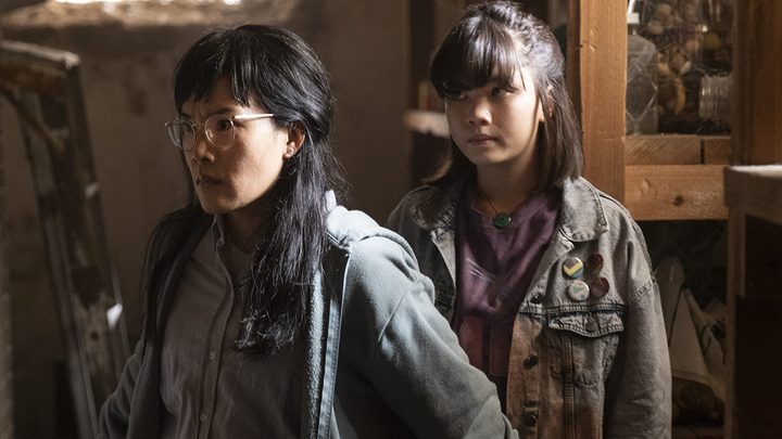 An older woman walks with a younger one behind her in a scene from Paper Girls on Amazon Prime Video.