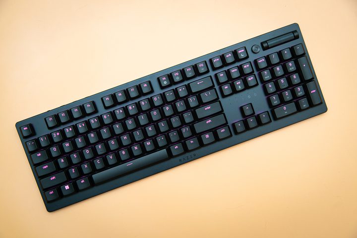 Razer DeathStalker V2 sitting on an orange background.