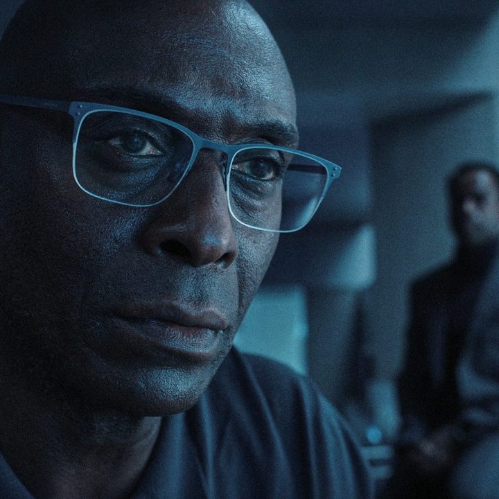 Lance Reddick stares intently in a scene from the Resident Evil series on Netflix.