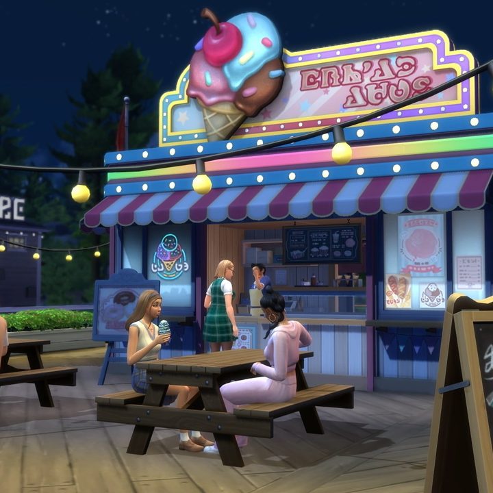Sims drink tea together at an ice cream shop in The Sims 4.