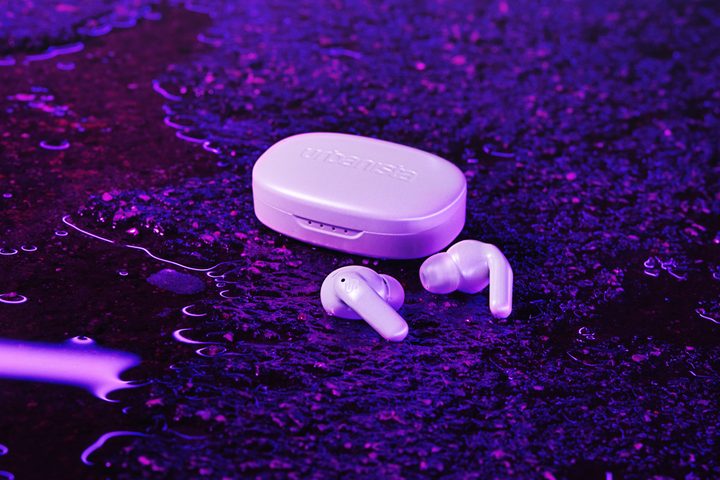 Urbanista Seoul earbuds sitting on the ground.