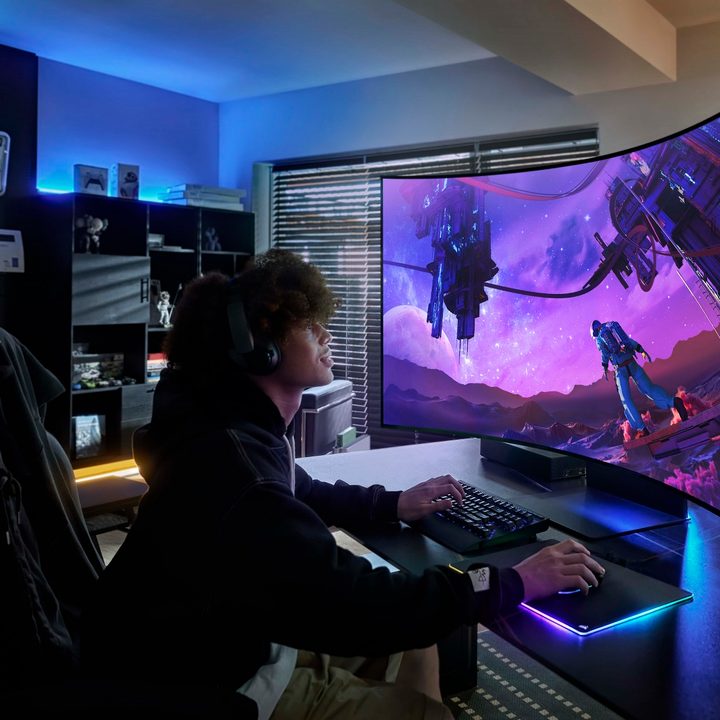 A gamer sits in front of the Samsung Odyssey ARK monitor.