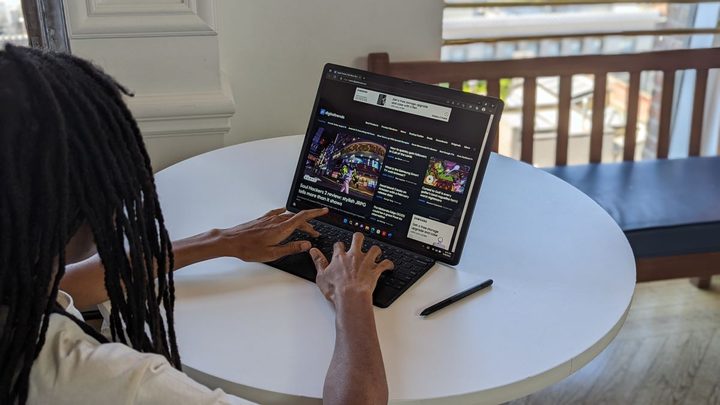 The 2022 ThinkPad X1 Fold in landscape mode attached to a keyboard.