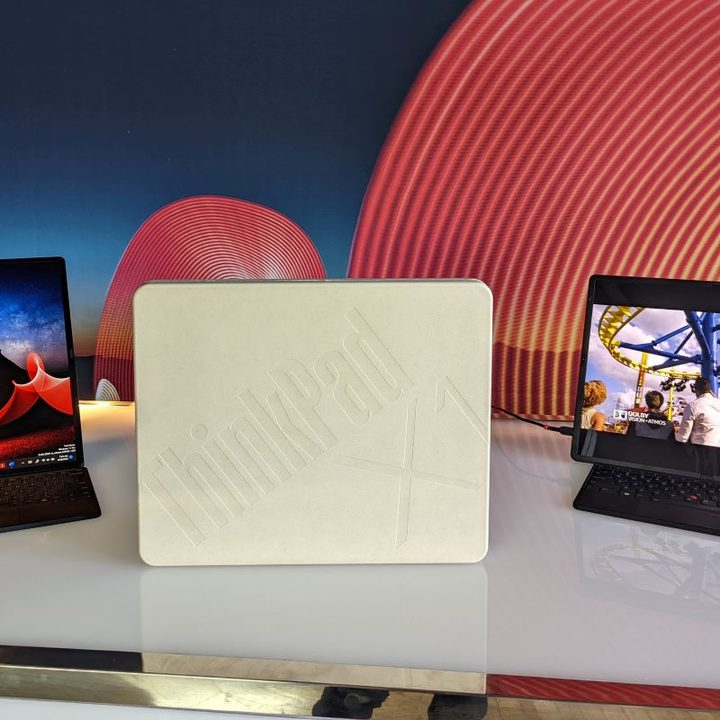 The 2022 ThinkPad X1 Fold shown standing in portrait and landscape modes with packaging.