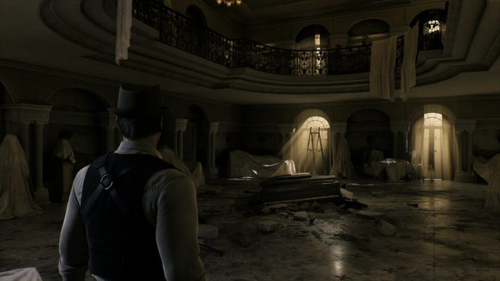 Carnby in an old ballroom.