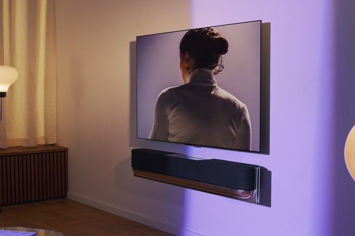 Bang & Olufsen Beosound Theatre seen wall-mounted below a TV.