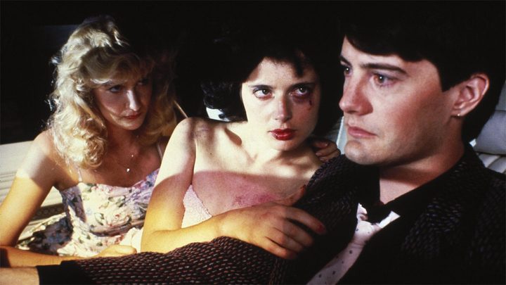 Sandy, Dorothy, and Jeffrey inside a car in Blue Velvet.