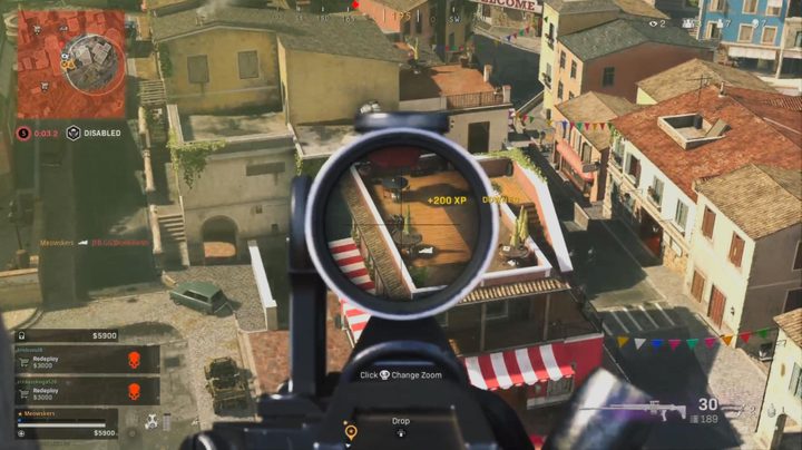 Firing at an enemy on a rooftop in Warzone.