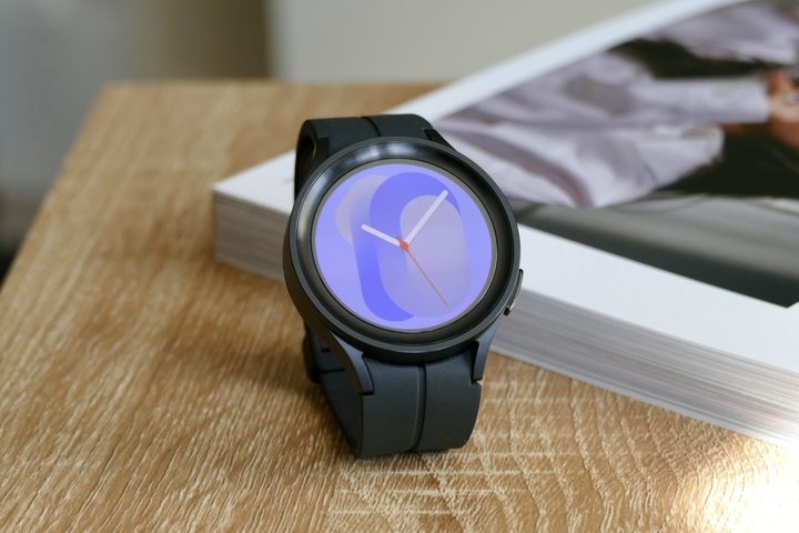 The Galaxy Watch 5 Pro showing a colorful watch face.