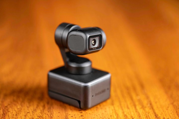 The Insta360 Link on a wooden tabletop.