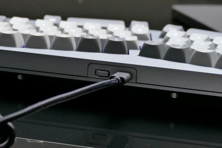 The switch and cable port on the back of the Keychron Q8.