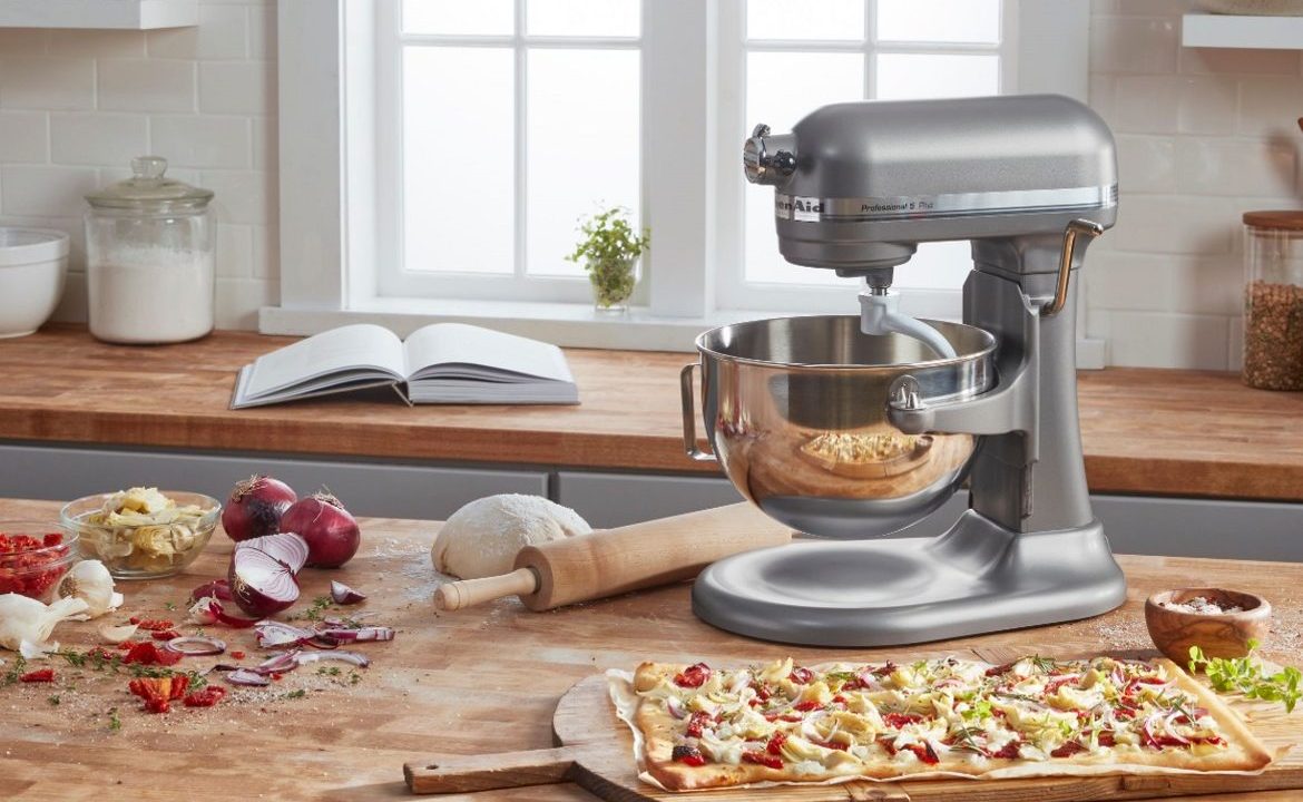 The KitchenAid Pro 5 Plus stand mixer on a kitchen table.