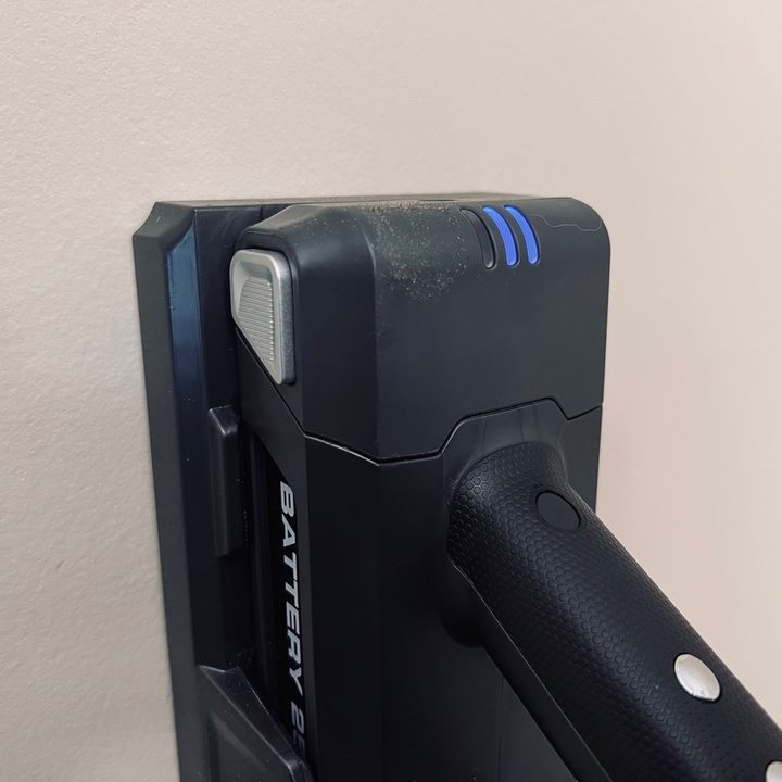 The Levoit VortexIQ 40 charging on its wall mount.